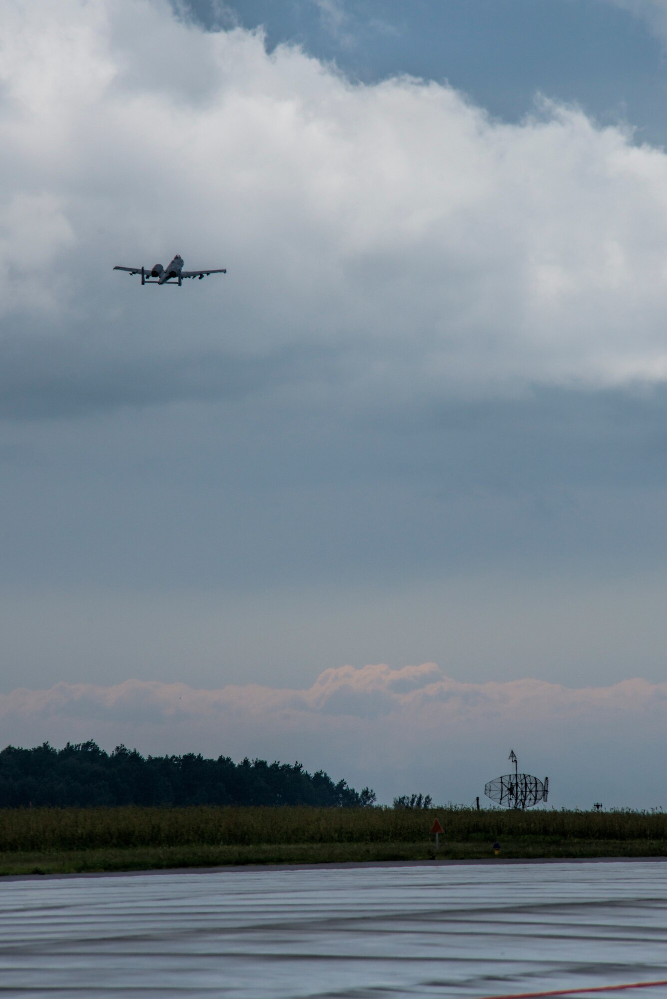 A U.S. Air Force A-10 Thunderbolt II attack aircraft pilot assigned to the 354th Expeditionary Fighter Squadron takes off from the runway during a theater security package deployment at Lask Air Base, Poland, July 9, 2015. U.S. Air Force Airmen conduct training alongside NATO allies to strengthen interoperability and demonstrate U.S. commitment to the security and stability of Europe. (U.S. Air Force photo by Staff Sgt. Christopher Ruano/Released)