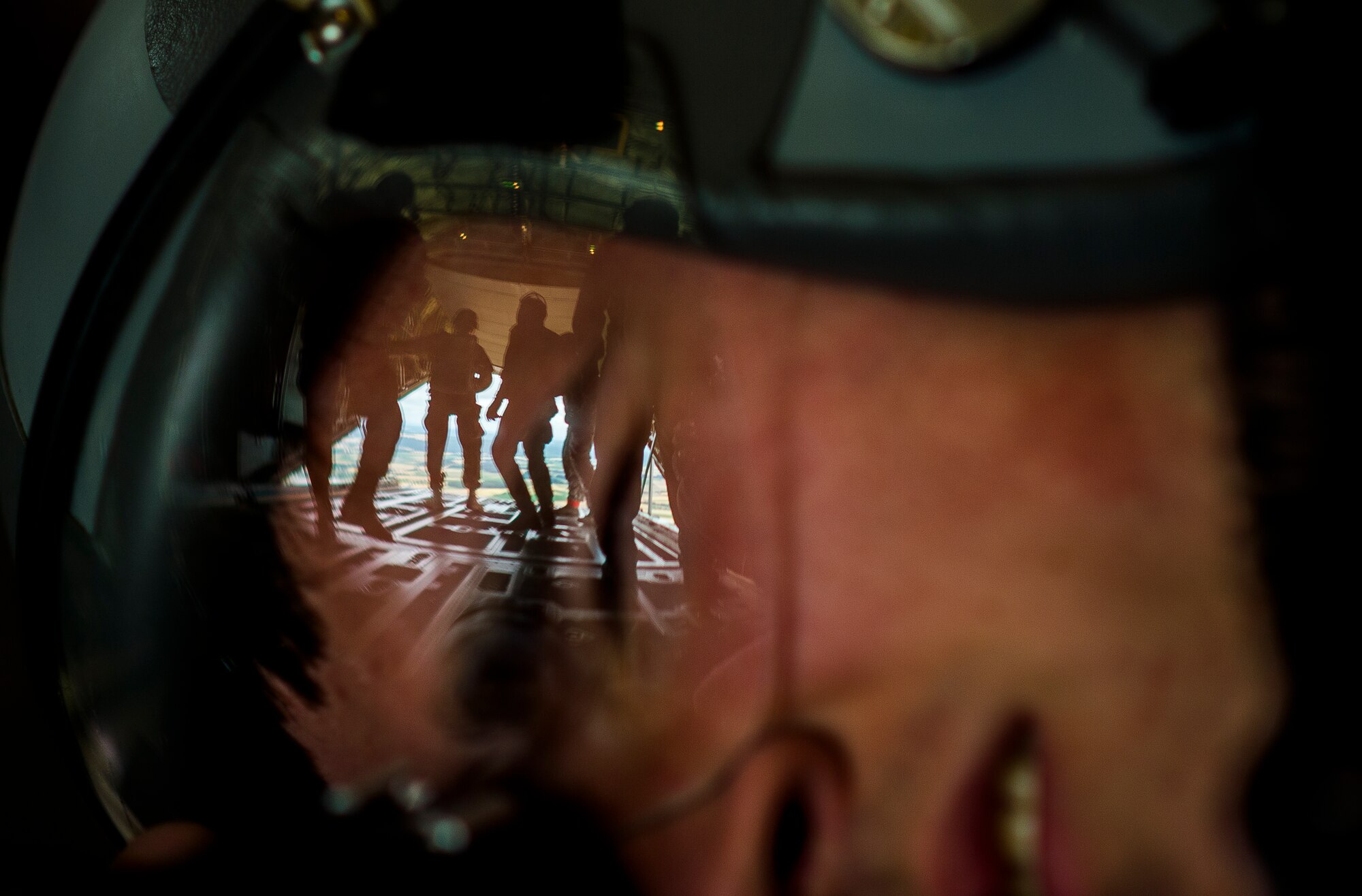 Airman 1st Class Lane Plummer, 86th Airlift Wing Public Affairs photojournalist, takes photos of paratroopers from multiple allied nations as they exit a C-130J Super Hercules during International Jump Week, July 9, 2015 at Ramstein Air Base, Germany. The five-day event was led by the 435th Contingency Response Group and it provided multiple nations the opportunity to work side-by-side, increasing interoperability and strengthening relationships. Paratroopers traveled from throughout Europe, including England, Poland, Greece, France, Germany, Estonia, Czech Republic, Belgium and as far away as New Zealand to build stronger partnerships by jumping out of C-130J Super Hercules’s assigned to the 37th Airlift Squadron at Ramstein. (U.S. Air Force photo/Senior Airman Damon Kasberg)