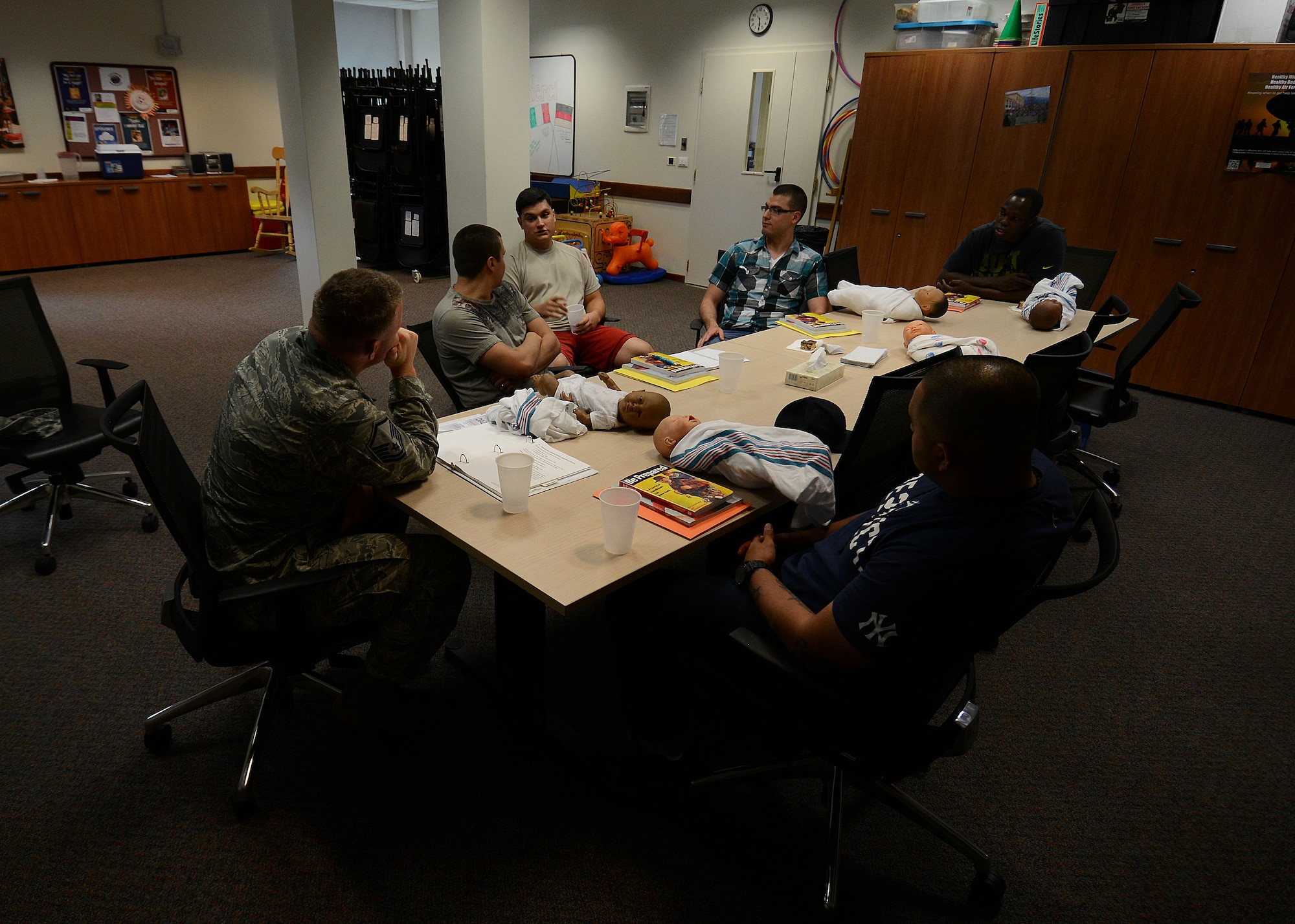 U.S. Air Force Airmen talk about fatherhood during the Daddy Boot Camp course July 8, 2015, at Aviano Air Base, Italy.  Aviano’s Family Advocacy hosts the course every first Tuesday of the month for new or expectant fathers. (U.S. Air Force photo by Staff Sgt. Evelyn Chavez)
