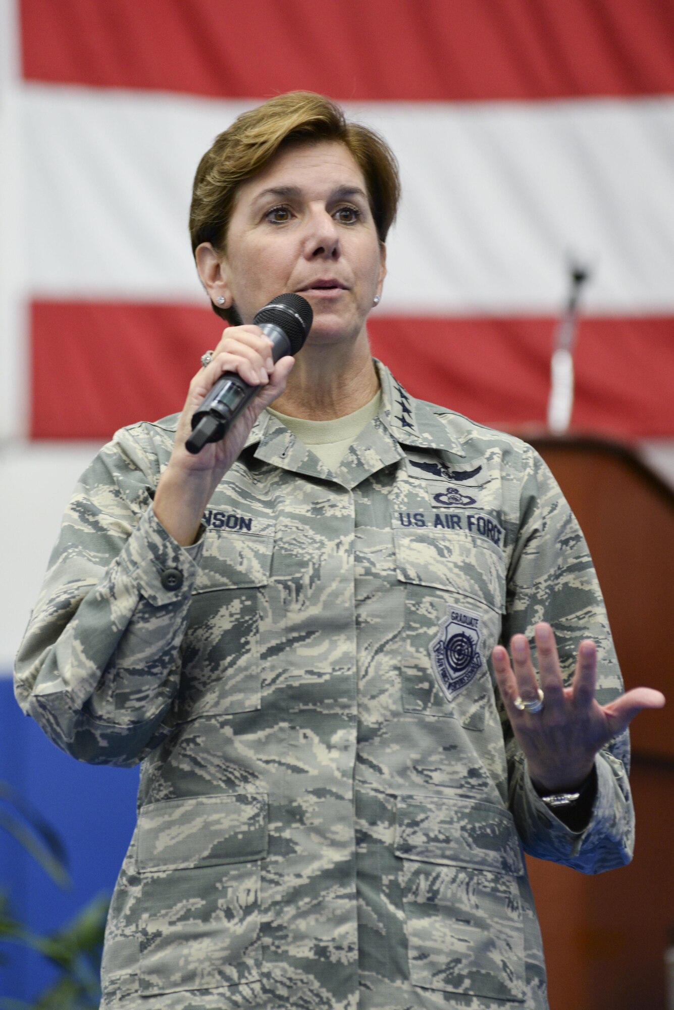 U.S. Air Force Gen. Lori Robinson, Pacific Air Forces commander, addresses Airmen during an all-call, July 10, 2015, at Andersen Air Force Base, Guam. Robinson outlined her priorities including taking care of Airmen and their families while accomplishing the mission. (U.S. Air Force photo by Senior Airman Katrina M. Brisbin/Released)