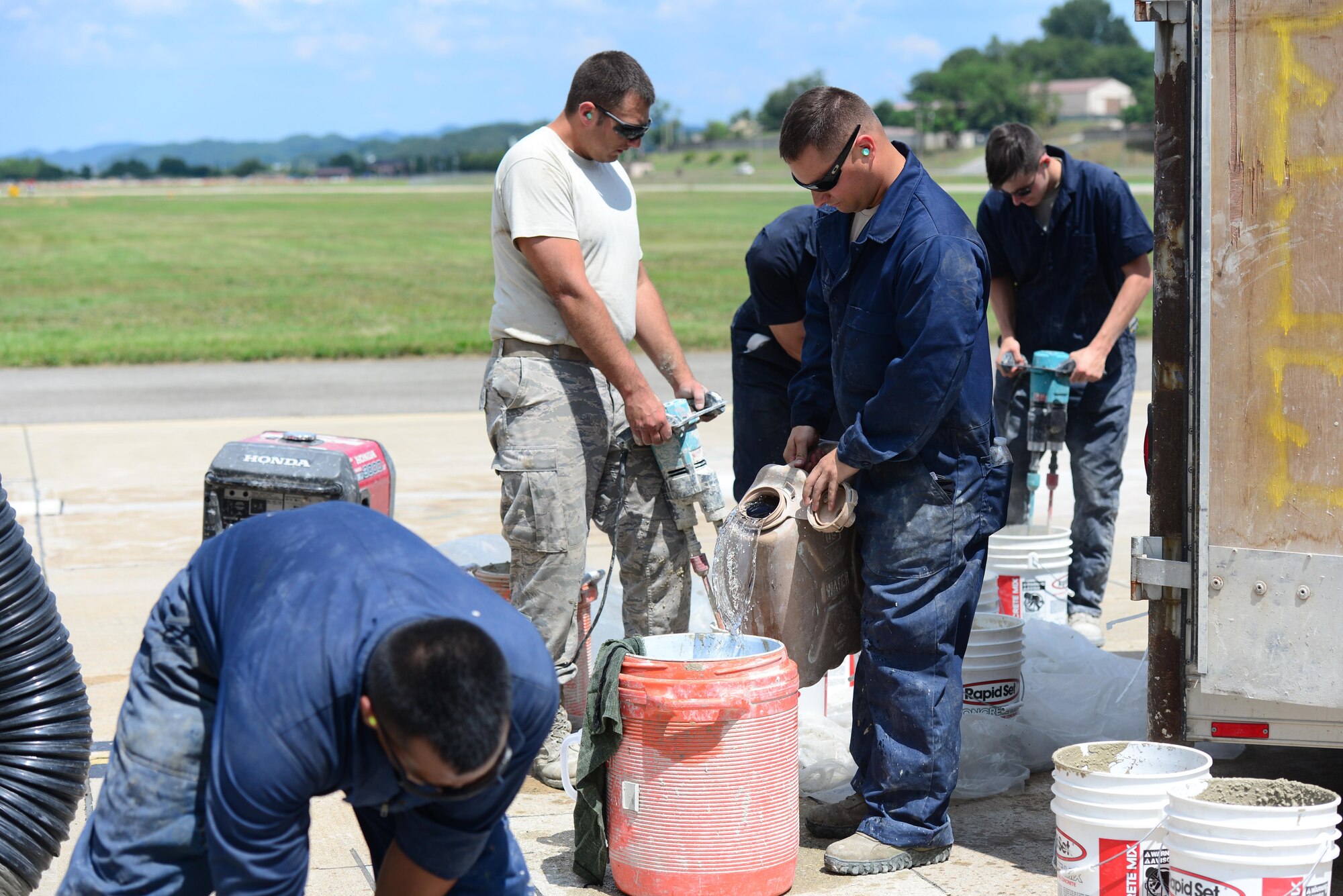 Airmen from the 51st Civil Engineer Squadron pavement and construction equipment shop, also known as the "Dirt Boyz," perform spot repairs on sections of the airfields at Osan Air Base, Republic of Korea, June 27, 2015. Since January 1, 2015 the "Boyz" have logged over 3,000 man hours completing more than 2,000 such repairs on the 1.5 million square yards of Osan's airfield. 
(USAF photo by Staff Sgt. Amber Grimm)