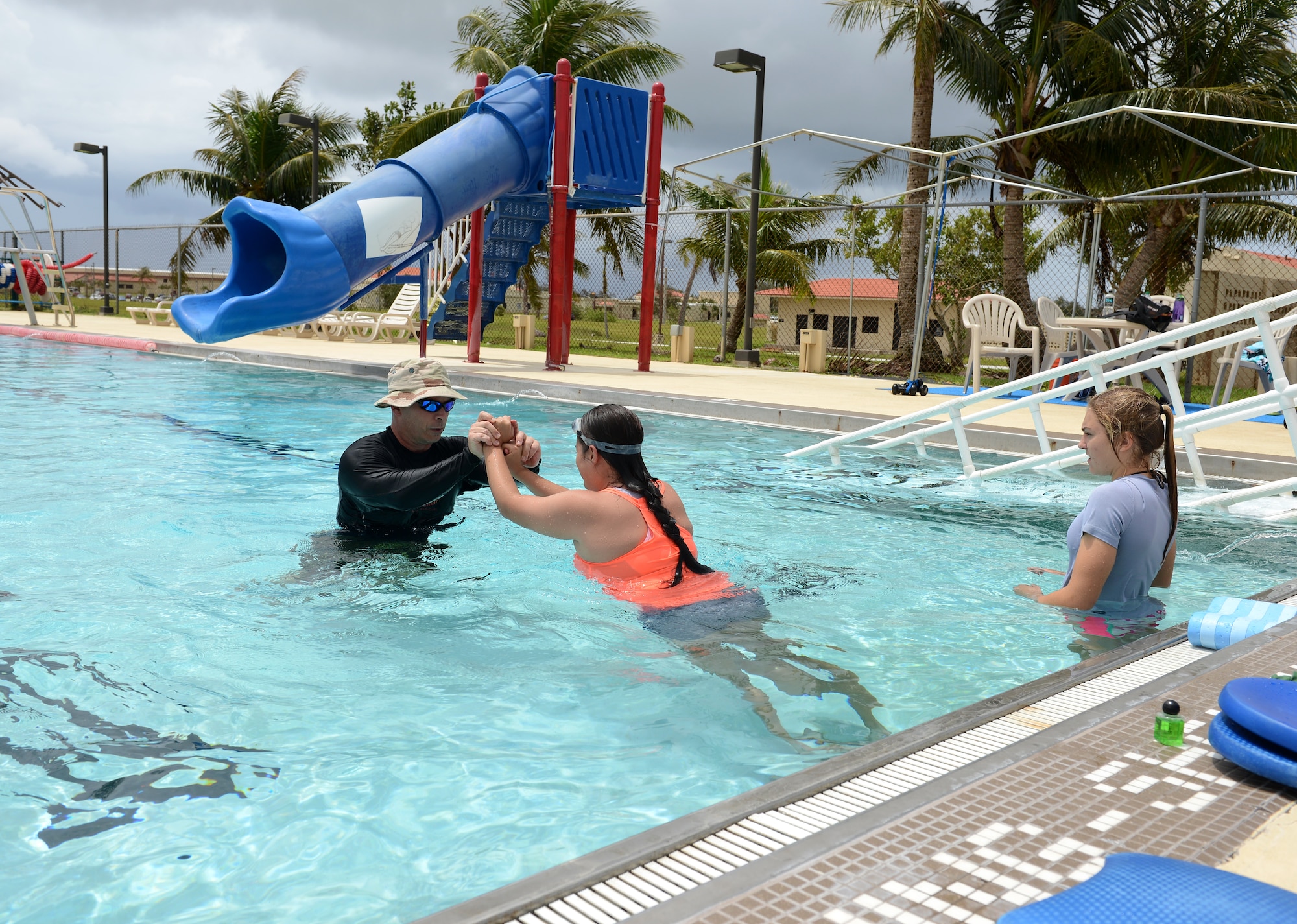 Maj. Michael Curtin, 36th Medical Operations Squadron Health Promotion Flight commander, instructs a group aquatic class July 7, 2015, at Andersen Air Force Base, Guam.  The class is designed for post-operation patients who need a lower impact exercise. (U.S. Air Force photo by Airman 1st Class Arielle Vasquez/Released)