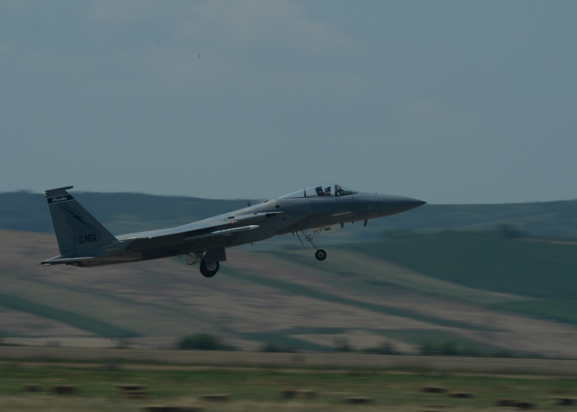A U.S. Air National Guard F-15C Eagle fighter aircraft assigned to the 123rd Expeditionary Fighter Squadron takes off during a theater security package deployment July 7, 2015, at Campia Turzii, Romania. The U.S. values the shared commitment and close cooperation with NATO partners on the security and stability of Europe. (U.S. Air Force photo by Senior Airman Dylan Nuckolls/Released)