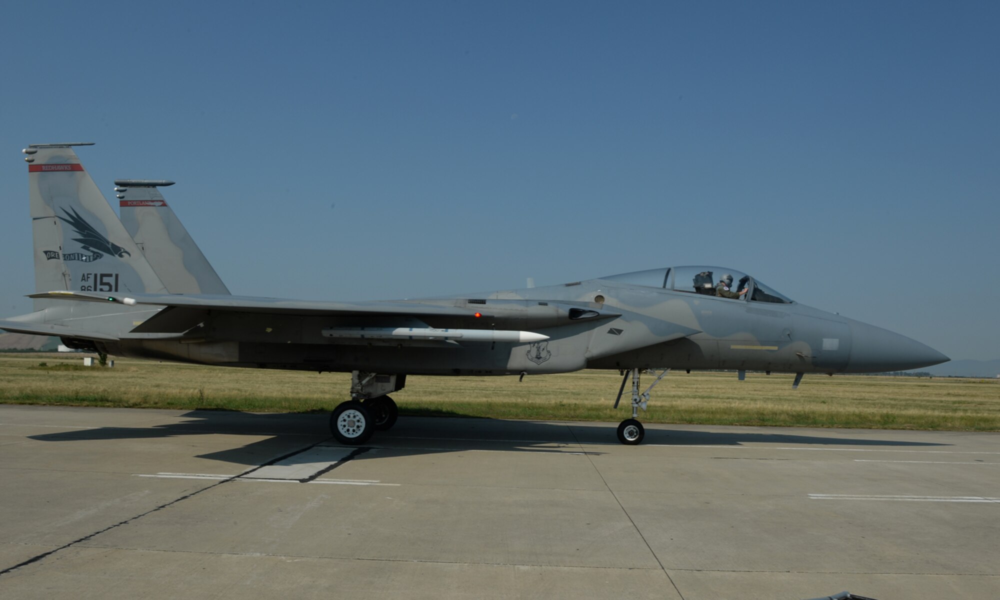 A U.S. Air National Guard F-15C Eagle fighter aircraft pilot assigned to the 123rd Expeditionary Fighter Squadron taxis during a theater security package deployment July 7, 2015, at Campia Turzii, Romania. The U.S. and Romanian air forces will conduct training aimed to strengthen interoperability and demonstrate the countries' shared commitment to the security and stability of Europe. (U.S. Air Force photo by Senior Airman Dylan Nuckolls/Released)
