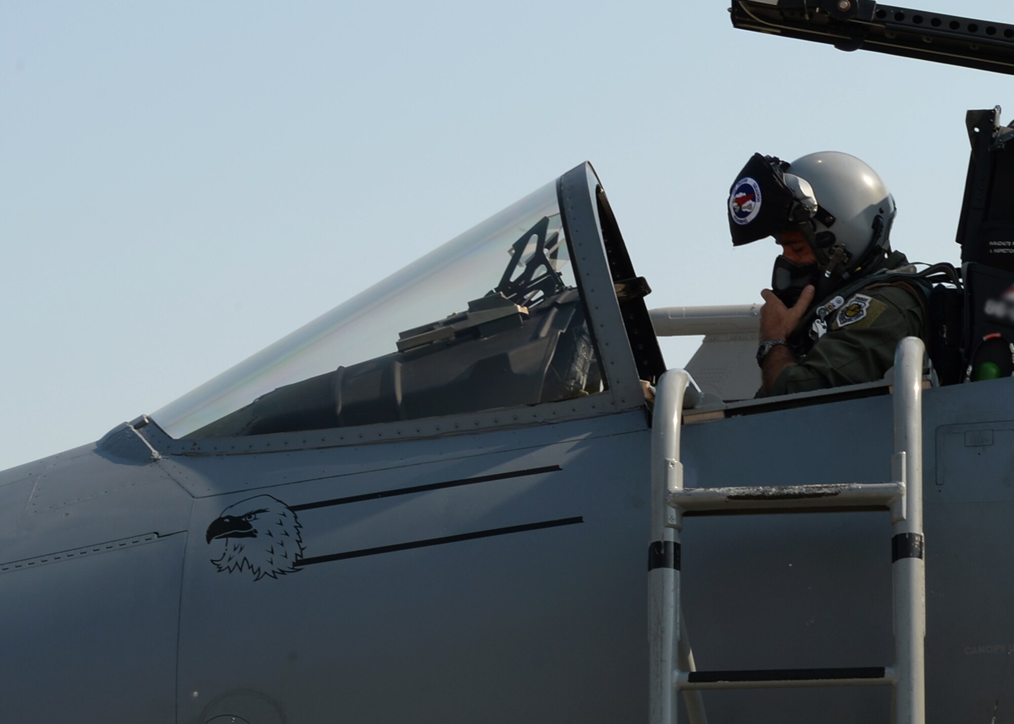 A U.S. Air National Guard F-15C Eagle fighter aircraft pilot assigned to the 123rd Expeditionary Fighter Squadron performs pre-flight checks July 7, 2015, at Campia Turzii, Romania. Twelve F-15C Eagles deployed to Romania as part of a European theater security package. (U.S. Air Force photo by Senior Airman Dylan Nuckolls/Released)