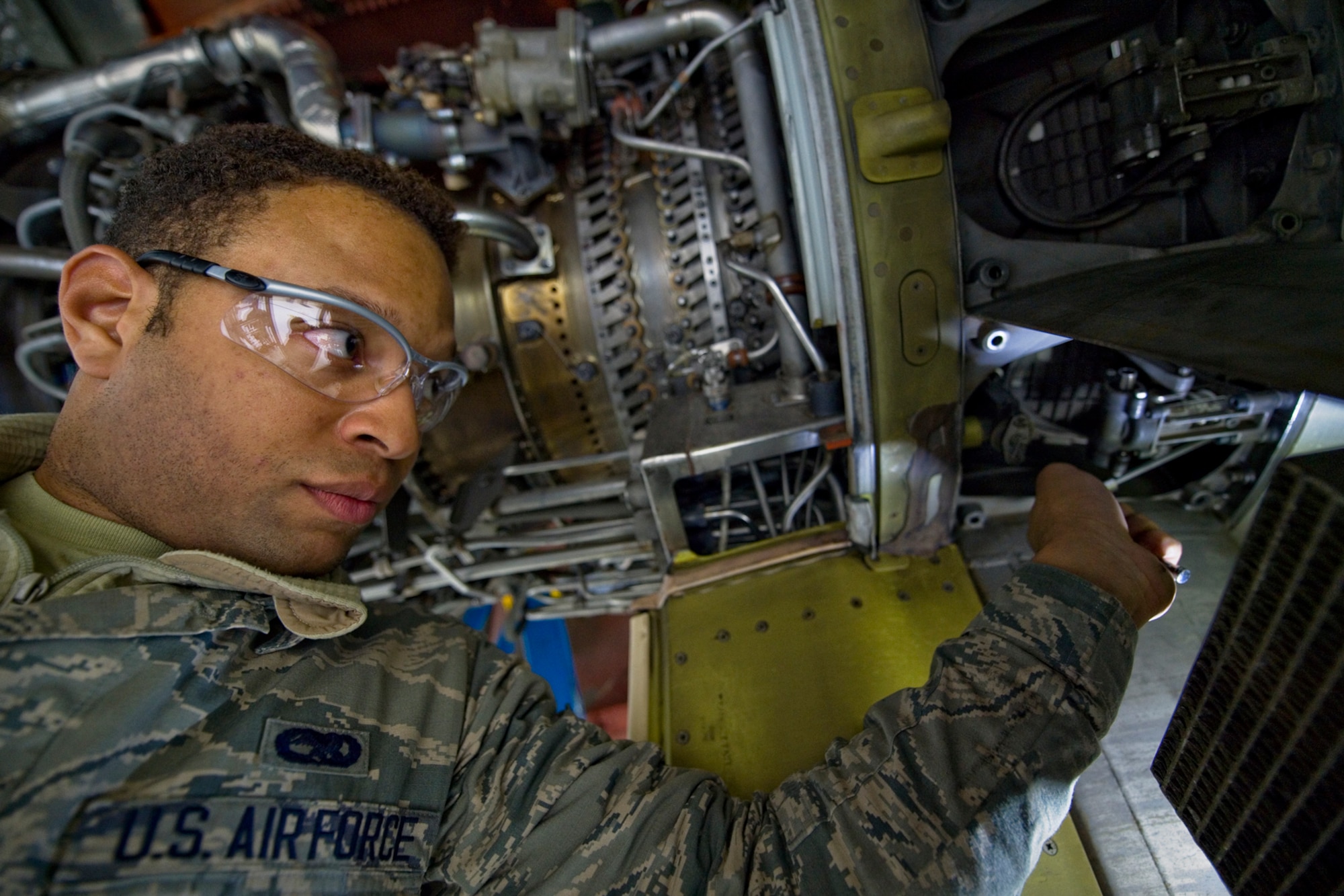 Senior Airman Larrick West, 434th Maintenance Squadron aerospace propulsion apprentice, installs a variable bleed valve on a CFM-56 turbofan engine of a KC-135R Stratotanker at Grissom Air Reserve Base, Ind., March 15, 2015. Each of the aircraft's four engines produce 21,634 pounds of thrust and must undergo routine inspections and maintenance. (U.S. Air Force photo/2nd Lt. Mark Orders-Woempner)