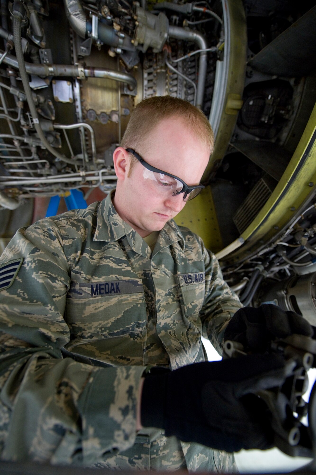 Staff Sgt. Michael Medak, 434th Maintenance Squadron aerospace propulsion journeyman, inspects a variable bleed valve on a CFM-56 turbofan engine of a KC-135R Stratotanker at Grissom Air Reserve Base, Ind., March 15, 2015. Each of the aircraft's four engines produce 21,634 pounds of thrust and must undergo routine inspections and maintenance. (U.S. Air Force photo/2nd Lt. Mark Orders-Woempner)
