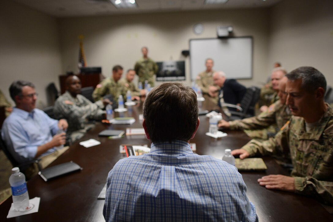 Defense Secretary Ash Carter, foreground, attends a roundtable meeting with Army Lt. Gen. Stephen J. Townsend, commanding general of the XVIII Airborne Corps, on Fort Bragg, N.C., July 10, 2015.