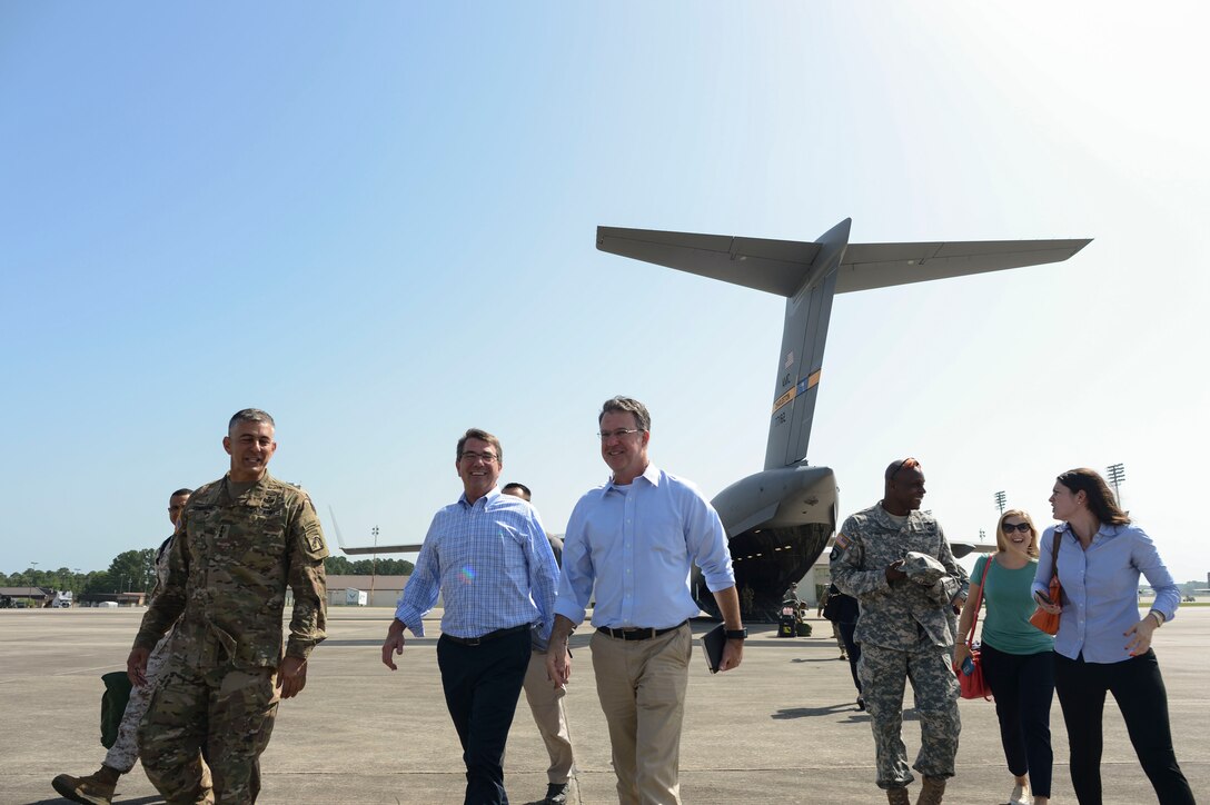 Defense Secretary Ash Carter, second from left, walks with Army Lt. Gen. Stephen J. Townsend, commanding general of the XVIII Airborne Corps, after observing airborne operations aboard a C-17 Globemaster at Pope Army Airfield on Fort Bragg, N.C., July 10, 2015.