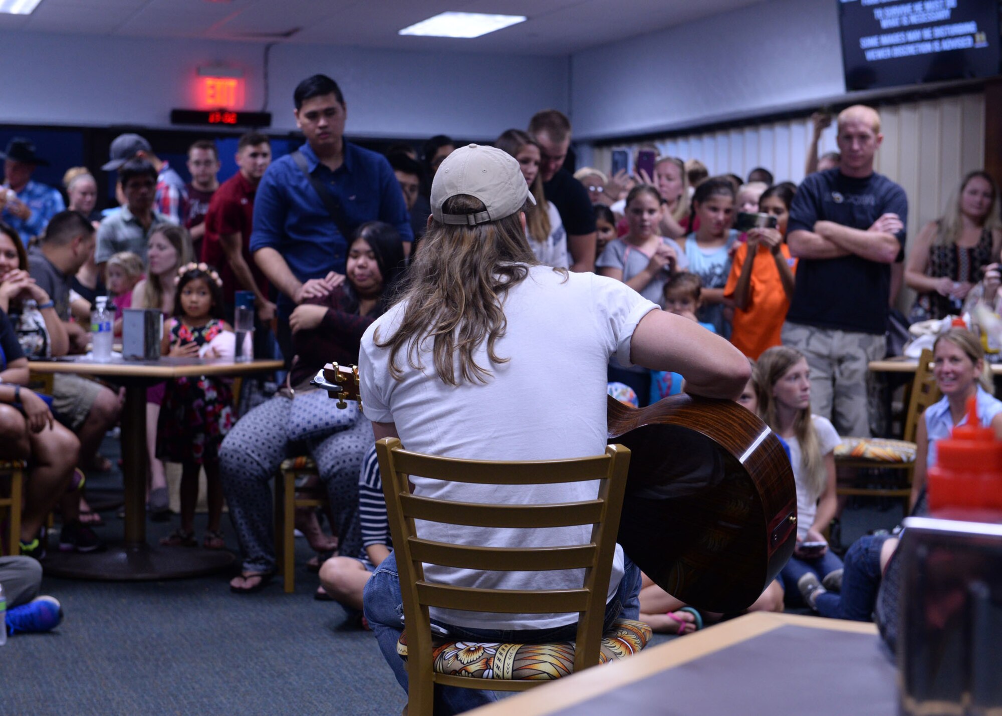 Jason Michael Carroll, country music artist, performs songs July 10, 2015, at Andersen Air Force Base, Guam. The free event provided service members and families an opportunity to break from their daily routine to enjoy music from popular recording artists. (U.S. Air Force photo by Airman 1st Class Joshua Smoot/Released)