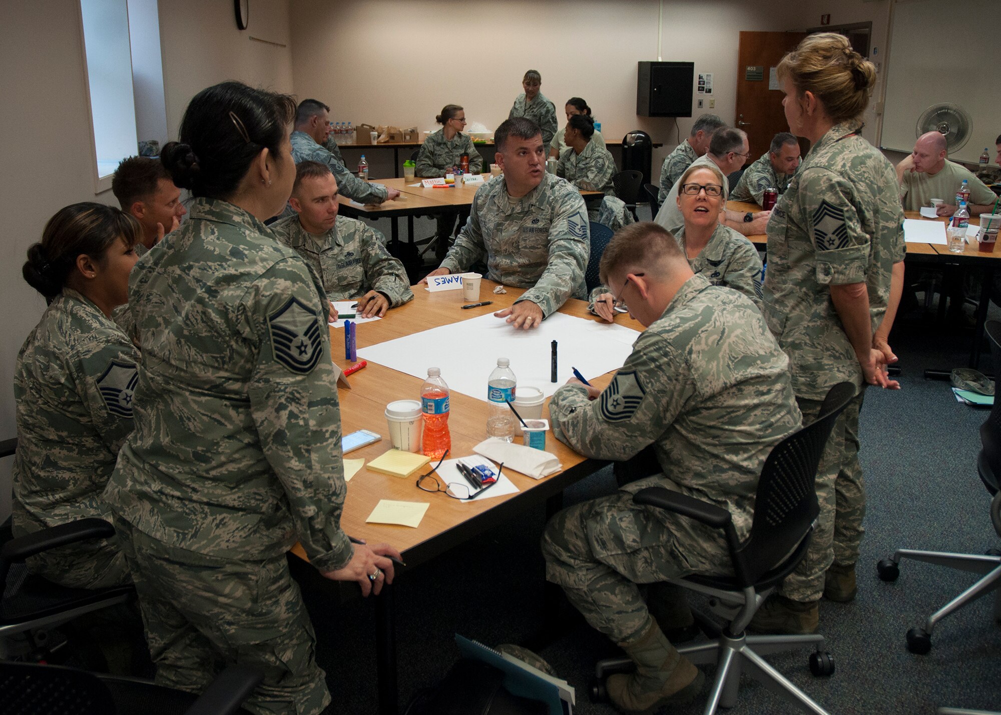 Senior noncommissioned officers from across the Air Force Reserve Command work on a class assignment July 12, 2015 during the Senior NCO Leadership Development Course at McChord Field. The Reservists participated in a two day class designed to enhance trust, teamwork and communication. (U.S. Air Force Reserve photo by Staff Sgt. Bryan Hull)