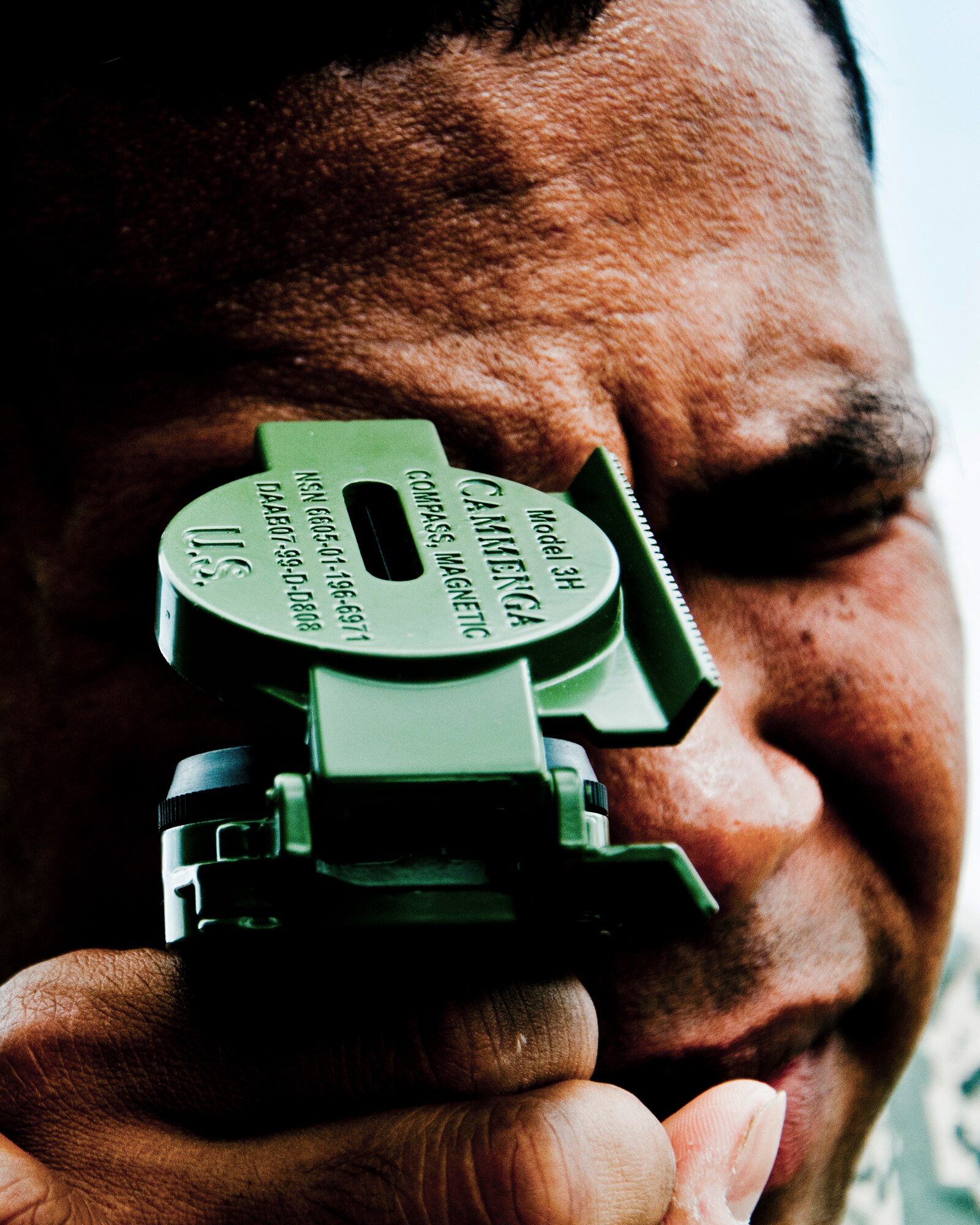 Senior Airman Paul Whatley 446th Aeromedical Staging Squadron medic,  uses an azimuth to locate waypoints during land navigation training for the Care Under Fire exercise at Joint Base Lewis-McChord, July 12, 2015.  The Care under Fire exercise was designed locally by the 446th ASTS in order to simulate combat conditions and establish team oriented training scenarios. Medics were offered land navigation training in order to enhance their combat readiness in austere locations. (U.S. Air Force photo by Senior Airman Daniel Liddicoet/Released)