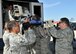 Airmen from the 920th Rescue Wing Aeromedical Staging Squadron, unload a litter during MEDBEACH 2015 joint service exercise at Patrick Air Force Base, Fla., July 11, 2015. This exercise prepares military medical personnel for deployments by providing realistic scenarios that they may see during a wartime situation. (U.S. Air Force photo by Tech. Sgt. Michael Means/Released)