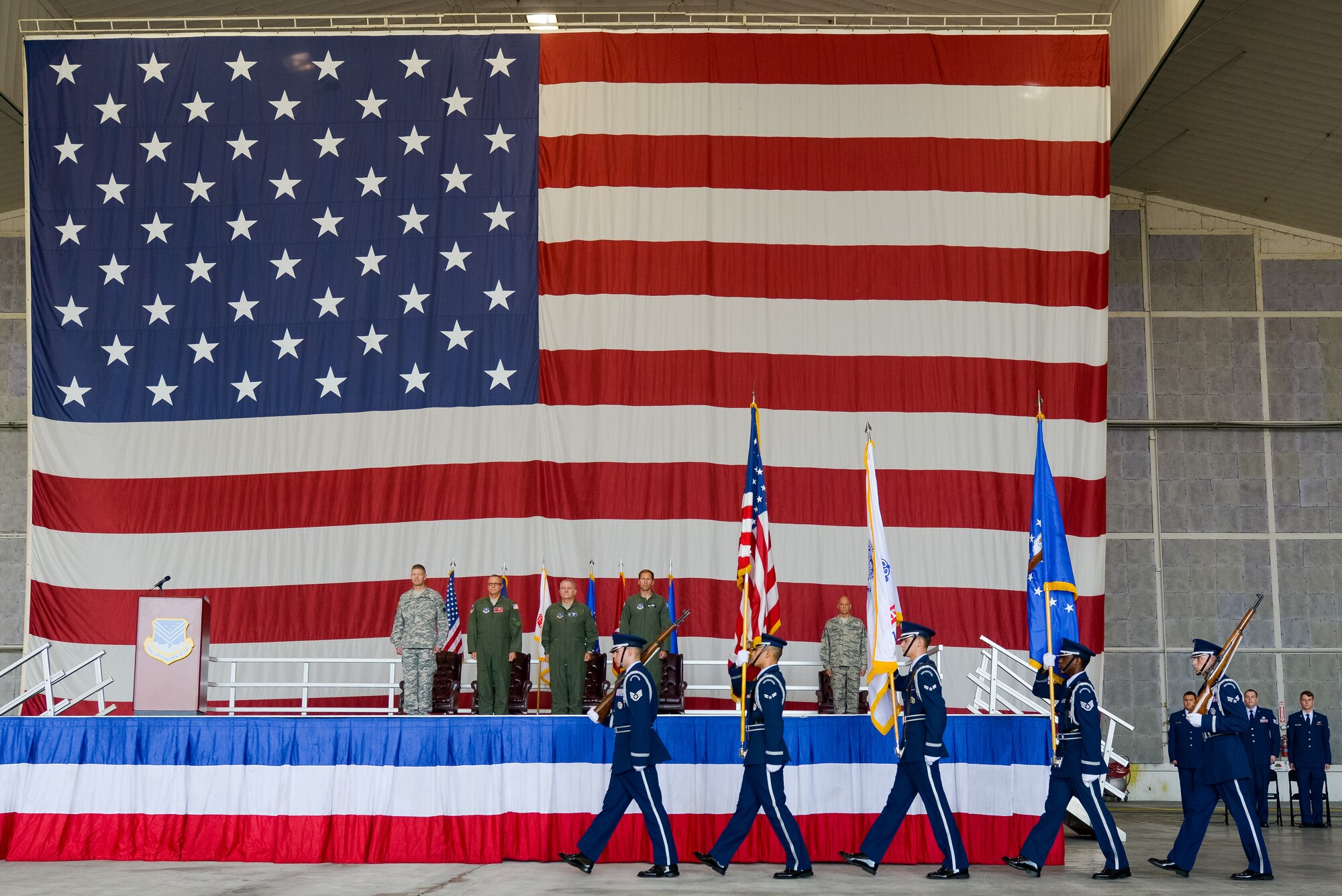 U.S. Airmen from the Robins Air Force Base Honor Guard present the colors during the 116th Air Control Wing (ACW) Change of Command ceremony at Robins Air Force Base, Ga., July 11, 2015. Col. Mark Weber assumed command of the 116th ACW from Col. Kevin Clotfelter during the ceremony officiated by Brig. Gen. Jesse Simmons Jr., commander, Georgia Air National Guard. The 116th ACW provides manned, joint airborne command and control, battle management, intelligence, surveillance, and reconnaissance support to combatant commanders around the globe flying the E-8C Joint STARS aircraft. (U.S. Air National Guard photo by Senior Master Sgt. Roger Parsons/Released)