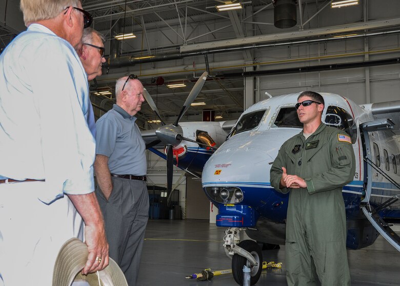 Maj.  Dan Johnston, a 711th Special Operations Squadron pilot, briefs retired general officers on the squadron’s C-145A aircraft at Duke Field, Fla., July 7. The 919th Special Operations Wing invited the distinguished visitors, some that included former commanders of the wing, for a base tour and briefings that updated them on the Air Force Reserve unit’s evolving mission. (U.S. Air Force photo/Dan Neely)
