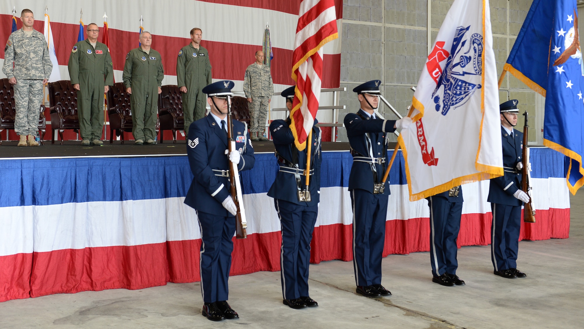 The Robins Air Force Honor Guard presents the colors during the 116th Air Control Wing (ACW), Georgia Air National Guard, change of command ceremony, Robins Air Force Base, Ga., July 11, 2015. Col. Mark Weber assumed command of the 116th ACW from Col. Kevin Clotfelter during a change of command ceremony officiated by Brig. Gen. Jesse Simmons Jr., commander, Georgia Air National Guard. The 116th ACW provides manned, joint airborne command and control, battle management, intelligence, surveillance, and reconnaissance support to combatant commanders around the globe flying the E-8C Joint STARS aircraft. (U.S. Air National Guard photo by Tech. Sgt. Regina Young/Released)