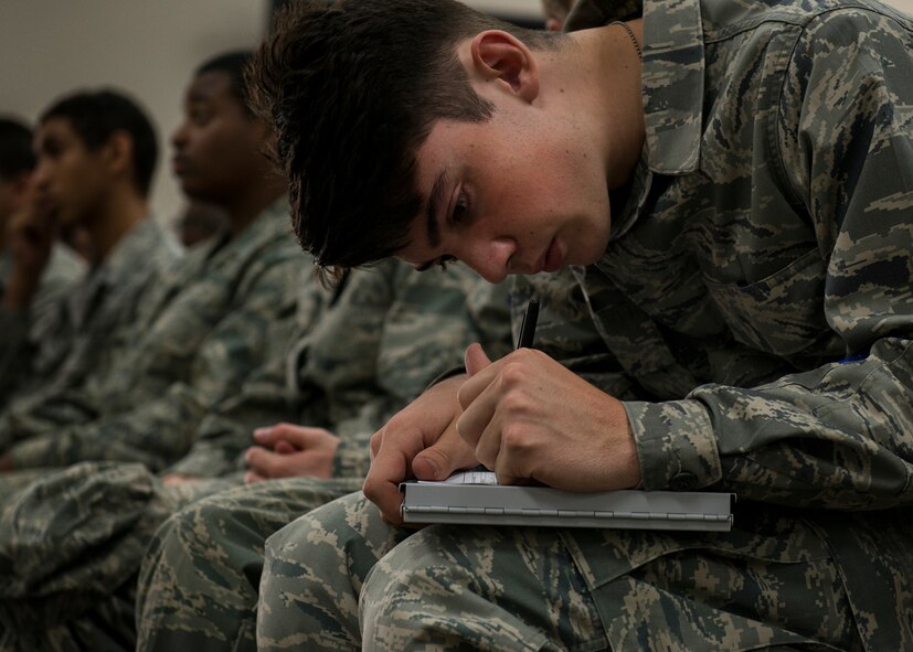 Noah Woods, ROTC student, signs the flight access roster during the ROTC Summer Leadership School July 7 at Duke Field, Fla.  50 cadets participated in the voluntary SLS program that teaches high school junior ROTC cadets, leadership, teamwork and self confidence in a highly structured and focused environment. (Air Force photo/Tech. Sgt. Jasmin Taylor)