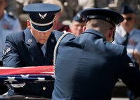 Airman 1st Class Logan Hall flattens out the flag during an Honor Guard graduation ceremony at Eglin Air Force Base, Fla. Approximately 12 new Airmen graduated from the 80-plus-hour course. The graduation performance includes flag detail, rifle volley, pall bearers and bugler for friends, family and unit commanders.  The Eglin Honor Guard provides their services to the base, Duke Field and more than 20 area counties making up approximately 20,000 square miles in the Florida and Alabama region.  (U.S. Air Force photo/Tech. Sgt. Sam King)
