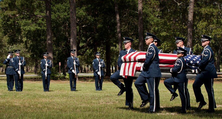 Members of the Eglin Air Force Base Honor Guard carry a casket during the unit’s recent graduation ceremony. Approximately 12 new Airmen graduated from the 80-plus-hour course. The graduation performance includes flag detail, rifle volley, pall bearers and bugler for friends, family and unit commanders. The Eglin Honor Guard provides their services to the base, Duke Field and more than 20 area counties making up approximately 20,000 square miles in the Florida and Alabama region.  (U.S. Air Force photo/Tech. Sgt. Sam King)