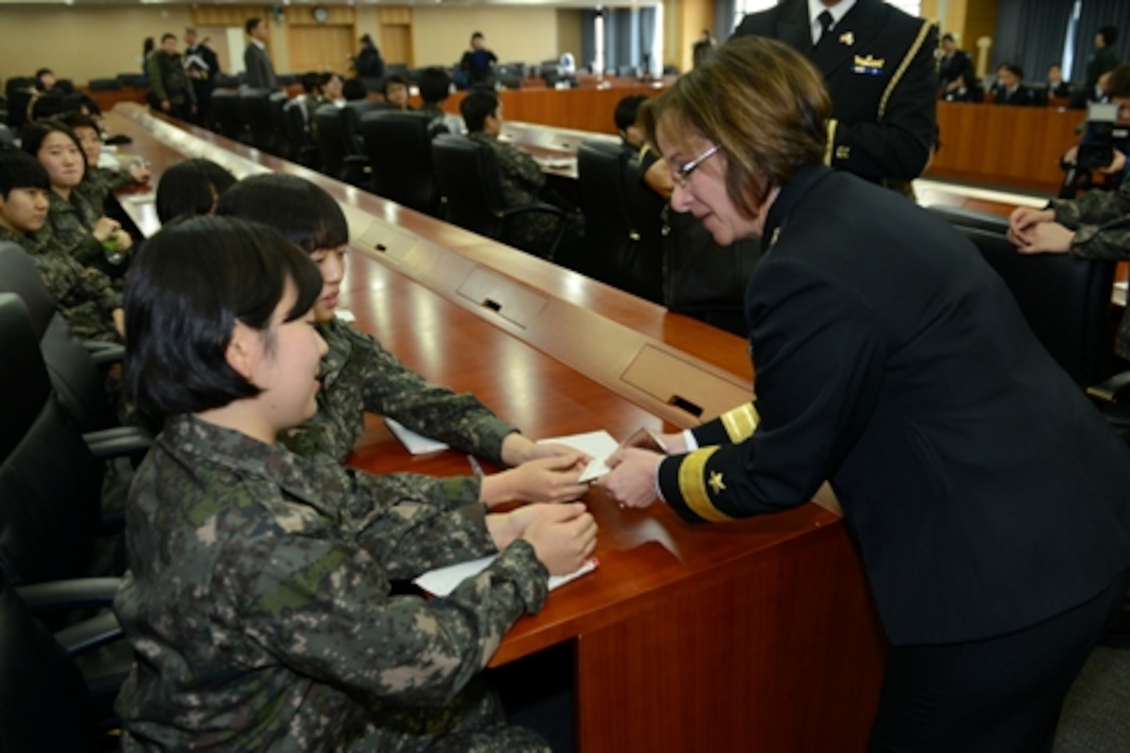 (140108_N_JN652_199) SEOUL, Republic of Korea (Jan. 8, 2014) – Rear Admiral Lisa Franchetti, Commander, U.S. Naval Forces Korea (CNFK), greets two female cadets from the 217 Reserve Officer’s Training Corps (ROTC) at Sookmyung University, Jan 8 after her lecture discussing her command philosophy and ideas on career development in the military.  (U.S. Navy Photo by Chief Mass Communication Specialist Wendy Wyman/Released)