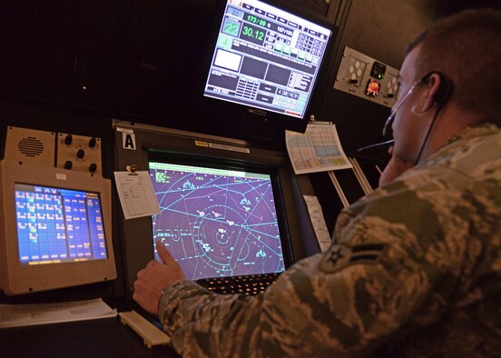 A U.S. Air Force Airman 1st Class with the 27th Special Operations Support Squadron Radar Approach Control unit performs daily operations within the RAPCON June 22, 2015 at Cannon Air Force Base, N.M. Cannon’s RAPCON members play a direct role in the wing’s ability to conduct mission essential flight operations. (U.S. Air Force photo/Staff Sgt. Alexx Mercer) 