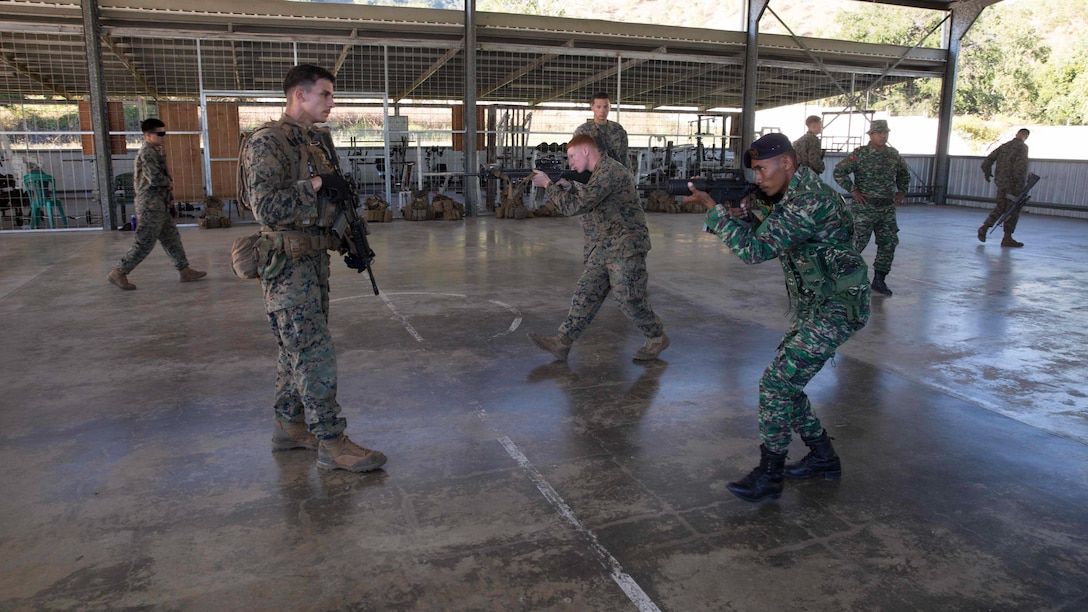 U.S. Marines with Company A, 1st Battalion, 4th Marine Regiment, Marine Rotational Force – Darwin, demonstrate weapons presentation during Exercise Koa Moana 15.2 in Dili, Timor-Leste, June 24. The platoon of Marines conducted a bilateral exercise with one platoon of the Timor-Leste Defence Force’s land component of the naval force and one platoon of their Marines, focusing on the fundamentals of squad and platoon-level tasks. The bilateral training included building room-clearing, urban movement and patrolling. The MRF-D six-month deployment demonstrates how the Marine Air Ground Task Force is equipped and organized to carry out national objectives in cooperation with our national and international partners. 