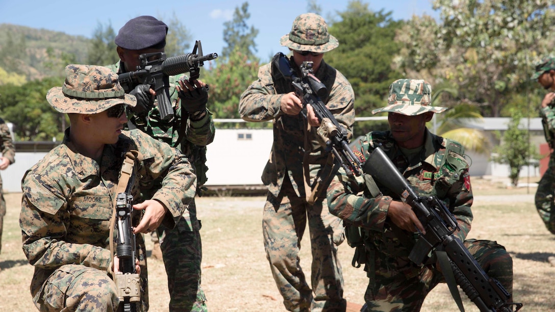 U.S. Marine Corps Lance Cpl. Eric Moore, a rifleman, and Lance Cpl. Chase Robinson, an automatic rifleman, both with Company A, 1st Battalion, 4th Marine Regiment, Marine Rotational Force – Darwin, and Timor-Leste Defence Force members participate in a room clearing exercise during Exercise Koa Moana 15.2 in Dili, Timor-Leste, June 24. The platoon of Marines conducted a bilateral exercise with one platoon of the Timor-Leste Defence Force’s land component of the naval force and one platoon of their Marines, focusing on the fundamentals of squad and platoon-level tasks.  The bilateral training included building room-clearing, urban movement and patrolling. The MRF-D six-month deployment demonstrates how the Marine Air Ground Task Force is equipped and organized to carry out national objectives in cooperation with our national and international partners. 