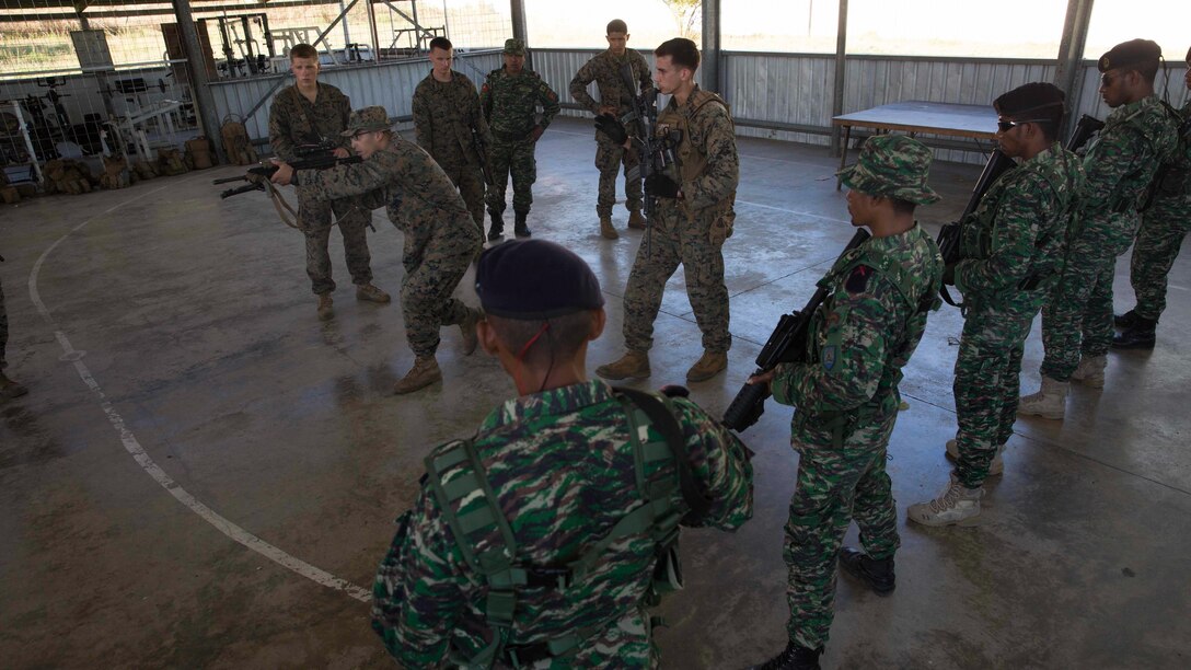 A platoon of U.S. Marines with Company A, 1st Battalion, 4th Marine Regiment, Marine Rotational Force – Darwin demonstrate weapons presentation to Timor-Leste Defence Force members during Exercise Koa Moana 15.2 in Dili, Timor-Leste, June 24. The platoon of U.S. Marines conducted a bilateral exercise with one platoon of the Timor-Leste Defence Force’s land component of the naval force and one platoon of their Marines, focusing on the fundamentals of squad and platoon-level tasks. The MRF-D six-month deployment demonstrates how the Marine Air Ground Task Force is equipped and organized to carry out national objectives in cooperation with our national and international partners. 
