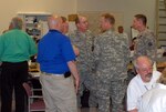 Missouri National Guard officers coordinate with their peers in other state and federal agencies during the National Level Exercise at Ike Skelton Training Site in May.