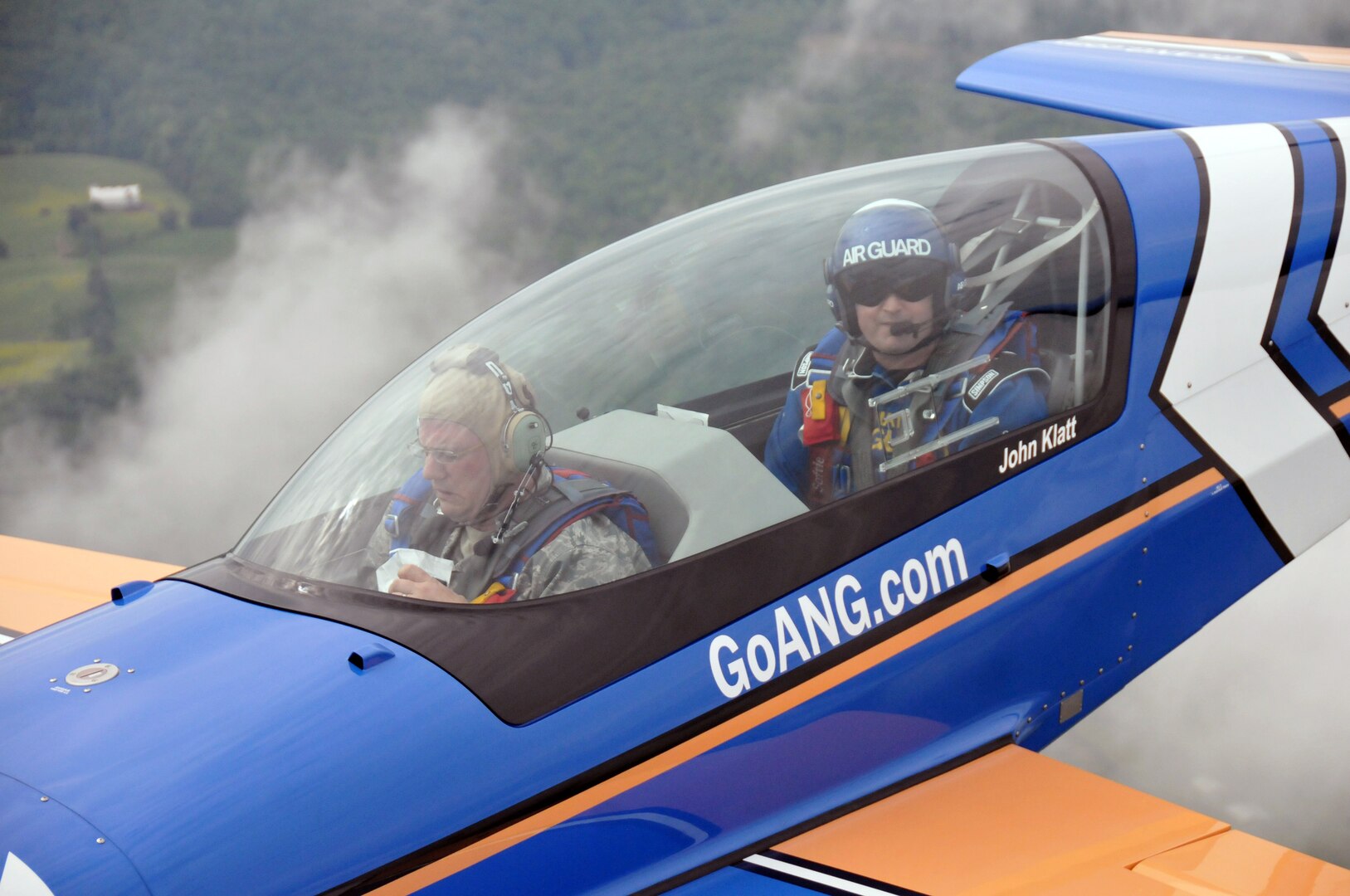 Air Force Lt. Col. John Klatt, the pilot of the Air National Guard's stunt
plane, practices techniques with Air Force Tech. Sgt. John Orrell riding
along in the front seat to gain a firsthand experience of what a stunt flyer
does, May 19, 2011. Klatt flies a Panzl S330 at most of the major air shows
across the United States, sharing the story and spreading the awareness of
the Air National Guard.
