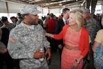 Dr. Jill Biden wishes Army Spc. Jezerie Blango of Newark, Del., good luck at his deployment ceremony in Harrington, Del., on May 21, 2011. Blango is deploying with the Delaware National Guard's 1049th Transportation Company.