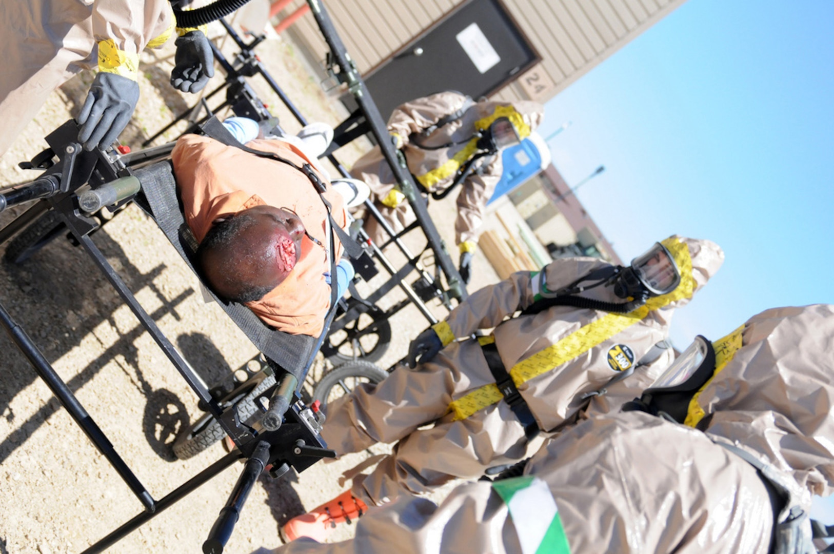 Members of the 434th Chemical Company, Minnesota National Guard CBRNE (Chemical, Biological, Radiological, Nuclear and High Explosives) Emergency Response Force Package, assist a role-player posing as a victim during a Vigilant Guard event at Volk Field, Monday, May 16. Vigilant Guard is a state wide exercise that demonstrates how local, state, and federal agencies would collaborate in response to real-life emergencies. CERFP teams provide immediate response capablities to large contaminations. 112th Mobile Public Affairs 