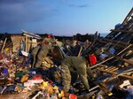 National Guard Soldiers with the 294th Engineer Company work search and
rescue missions in Joplin, Mo., just hours after a deadly tornado passed
through on May 22, 2011.