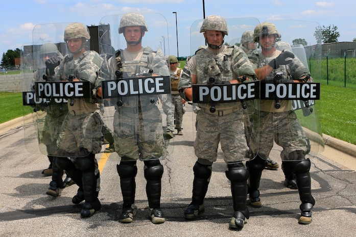 The 179th Airlift Wing Security Forces Squadron, Mansfield, Ohio, is conducting a confrontation management exercise July 11, 2015. Ohio Air National Guardsmen are required to be ready to handle civil unrest situations at home or abroad in a professional manner using non-lethal methods. The exercise prepares the members for a variable amount of resistance or violence toward them. (U.S. Air National Guard Photo by Tech. Sgt. Joseph Harwood/Released)