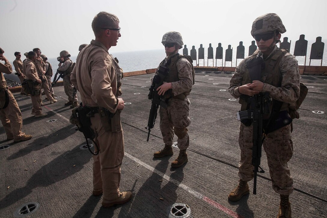 GULF OF ADEN (July 7, 2015) U.S. Marines with the 15th Marine Expeditionary Unit execute a deck shoot aboard the amphibious assault ship USS Essex (LHD 2). These Marines are participating in a week-long screening program to become a member of a Female Engagement Team. The 15th MEU is embarked on the Essex ARG and deployed to maintain regional security in the U.S. 5th Fleet area of operations. (U.S. Marine Corps photo by Cpl. Anna Albrecht/Released)