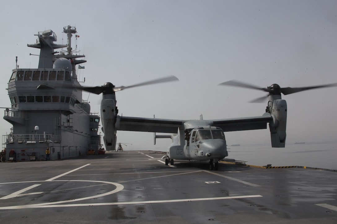 GULF OF ADEN (July 5, 2015) An MV-22B Osprey from the “Greyhawks” of Marine Medium Tiltrotor Squadron 161 (Reinforced), 15th Marine Expeditionary Unit, lands on the flight deck of the French amphibious assault ship BPC Dixmude (L9015). U.S. Sailors and Marines of the 15th MEU and Essex Amphibious Ready Group landed aboard the Dixmude to further enhance bi-lateral cooperation and interoperability between the two militaries. The 15th MEU is embarked within the Essex ARG and are deployed to maintain regional security in the U.S. 5th Fleet area of operations. (U.S. Marine Corps photo by Staff Sgt. Miguel Carrasco/Released)