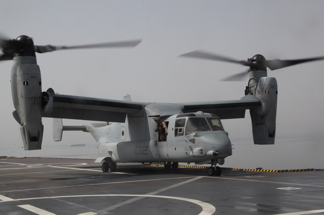 GULF OF ADEN (July 5, 2015) An MV-22B Osprey from the “Greyhawks” of Marine Medium Tiltrotor Squadron 161 (Reinforced), 15th Marine Expeditionary Unit, prepares to take off from on the flight deck of the French amphibious assault ship Dixmude (L9015). The U.S. Marines and Sailors of the 15th MEU and Essex Amphibious Ready Group landed aboard the Dixmude to further enhance bi-lateral cooperation and interoperability between the two militaries. The 15th MEU is embarked within the Essex ARG and deployed to maintain regional security in the U.S. 5th Fleet area of operations. (U.S. Marine Corps photo by Staff Sgt. Miguel Carrasco/Released)