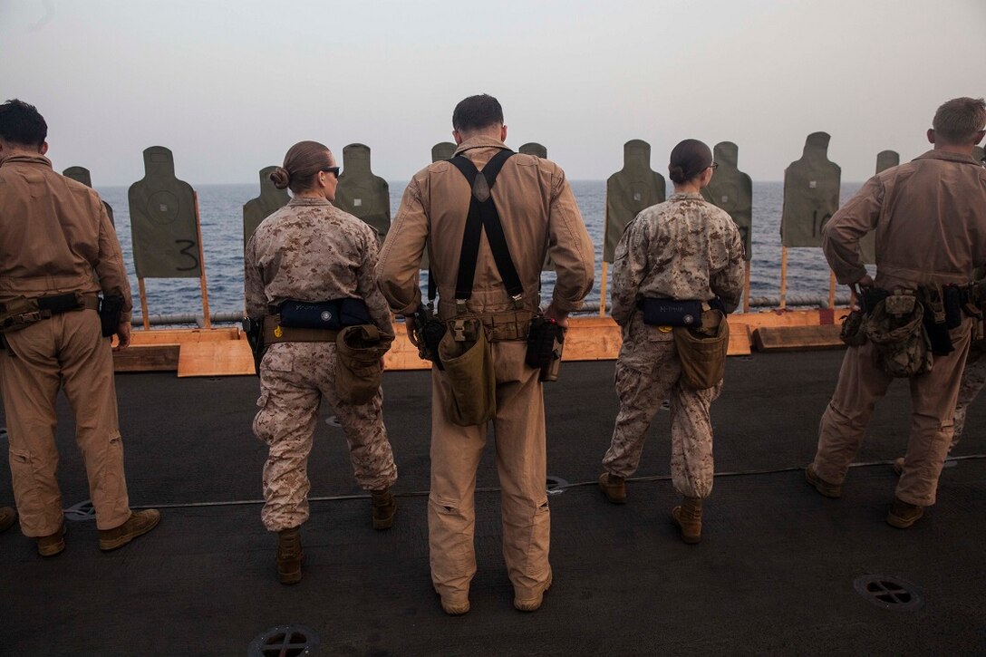 GULF OF ADEN (July 8, 2015) U.S. Marines with the 15th Marine Expeditionary Unit work on their pistol marksmanship fundamentals aboard the amphibious assault ship USS Essex (LHD 2). These Marines are participating in a week-long screener to become a member of a Female Engagement Team. The 15th MEU is embarked aboard the Essex Amphibious Ready Group and deployed to maintain regional security in the U.S. 5th Fleet area of operations. (U.S. Marine Corps photo by Cpl. Anna Albrecht/Released)