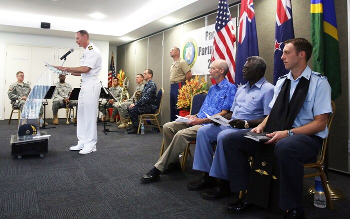 HONIARA, Guadalcanal (July 13, 2015) - Commodore, Task Force Forager Capt. James Meyer gives a speech during the opening ceremony for Pacific Partnership 2015 in the Solomon Islands. Task Force Forager is embarked aboard the Military Sealift Command joint high speed vessel USNS Millinocket (JHSV 3). Millinocket is serving as the secondary platform for Pacific Partnership, led by an expeditionary command element from the Navy's 30th Naval Construction Regiment (30 NCR) from Port Hueneme, Calif. Now in its 10th iteration, Pacific Partnership is the largest annual multilateral humanitarian assistance and disaster relief preparedness mission conducted in the Indo-Asia Pacific region. While training for crisis conditions, Pacific Partnership, missions have provided medical care to approximately 270,000 patients and veterinary service to more than 38,000 animals. Additionally, Pacific Partnership has provided critical infrastructure development to host nations through the completion of more than 180 engineering products.