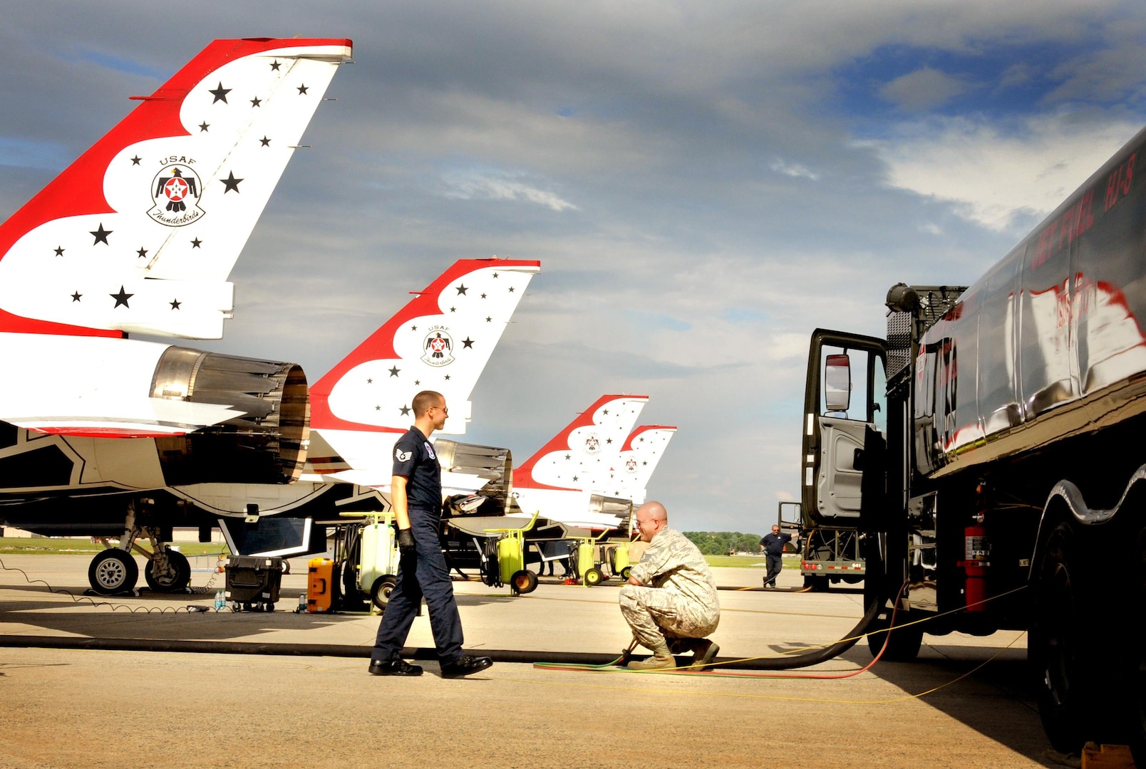 Air Force Tech. Sgt. Anthony “Tony” Bowman, 113th Logistics Readiness Squadron Fuels Lab technician, from the D.C. Air National Guard, fuels up an U.S. Air Force Thunderbirds, F-16C Fighting Falcon aircraft with an alternative bio-fuel blend made up of 50 percent camelina-based bio-fuel and 50 percent regular Jet Propellant 8 (JP-8) fuel, while Air Force Staff Sgt. Luke Miller, Thunderbird aircraft maintainer, watches. More than 3,000 gallons of bio-fuel was mixed with 3,000 gallons of JP-8 for use by the Thunderbirds for the 2011 Joint Service Open House.