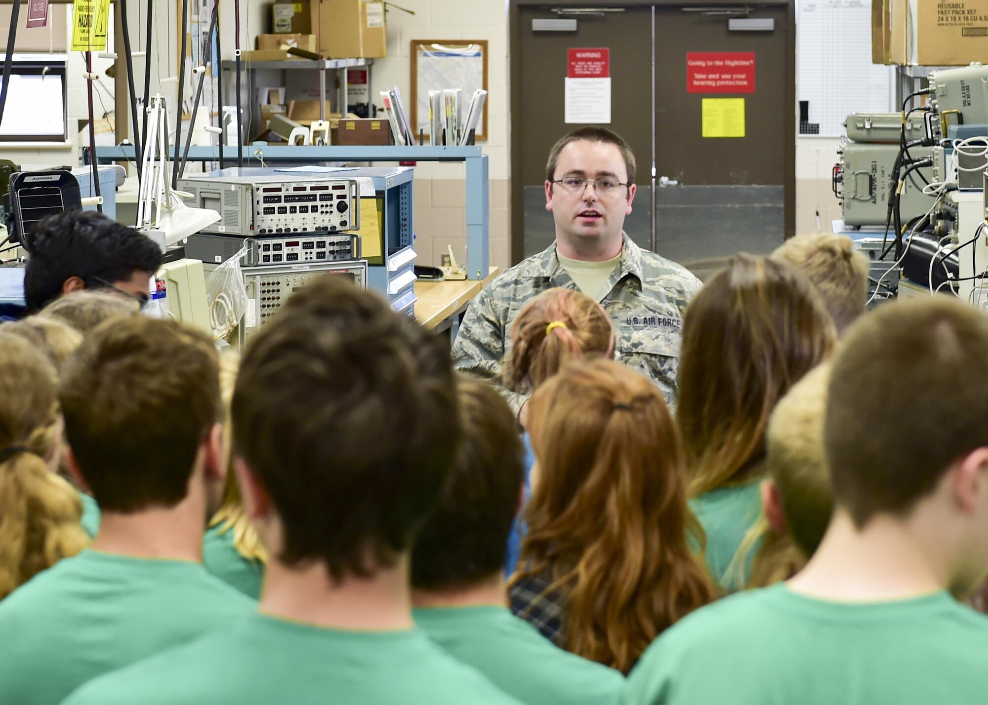Tech. Sgt. Denver Craddock, Communications and Navigation Systems with the 910th Maintenance Squadron, demonstrates aircraft avionics equipment during a tour here, July 10, 2015. The Alliance Ulster Project, which exists to promote unity between Roman Catholics and Protestants, brought a group of U.S. and Irish teenagers to tour Youngstown Air Reserve Station as part of their summer program. U.S. Air Force photo/Eric M. White