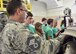 Senior Master Sgt. Bob Pierce, aerospace propulstion superintendent with the 910th Maintenance Squadron, exhibits a cutaway C-130H Hercules aircraft during a tour here, July 10, 2015. The Alliance Ulster Project, which exists to promote unity between Roman Catholics and Protestants, brought a group of U.S. and Irish teenagers to tour Youngstown Air Reserve Station as part of their summer program. U.S. Air Force photo/Eric M. White