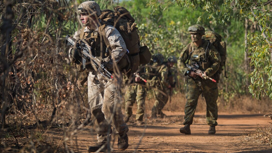 U.S. Marines, assigned to Battalion Landing Team, 2nd Battalion, 5th Marines, along with Australian Army Soldiers, assigned to 2nd Battalion, Royal Australian Regiment, move toward an objective during an amphibious assault for Talisman Sabre 2015 at Fog Bay, Australia, July 11, 2015. Talisman Sabre is a biennial exercise that provides an invaluable opportunity for nearly 30,000 U.S. and Australian defense forces to conduct operations in a combined, joint and interagency environment that will increase both countries’ ability to plan and execute a full range of operations from combat missions to humanitarian assistance efforts. 
