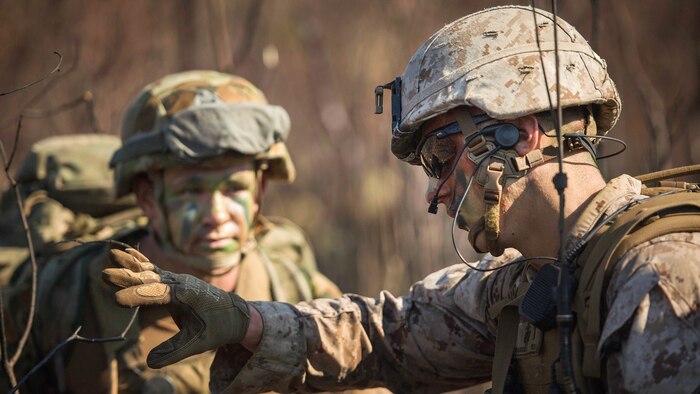 1st Lt. Carson Fletcher, assigned to Battalion Landing Team, 2nd Battalion, 5th Marines, speaks with an Australian Army Soldier, assigned to 2nd Battalion, Royal Australian Regiment, during an amphibious assault for Talisman Sabre 2015 at Fog Bay, Australia, July 11, 2015. Talisman Sabre is a biennial exercise that provides an invaluable opportunity for nearly 30,000 U.S. and Australian defense forces to conduct operations in a combined, joint and interagency environment that will increase both countries’ ability to plan and execute a full range of operations from combat missions to humanitarian assistance efforts. (U.S. Navy photo by Mass Communication Specialist 2nd Class Daniel M. Young/Released)