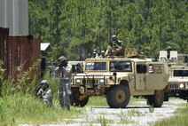 A Humvee column advances their simulated assault during tactical convoy training at Eglin Range, Fla., July 1, 2015. The 1st SOCES conducted convoy training as preparation to repair or construct equipment and facilities outside the wire during deployments.  (U.S. Air Force photo by Airman Kai White/Released)
