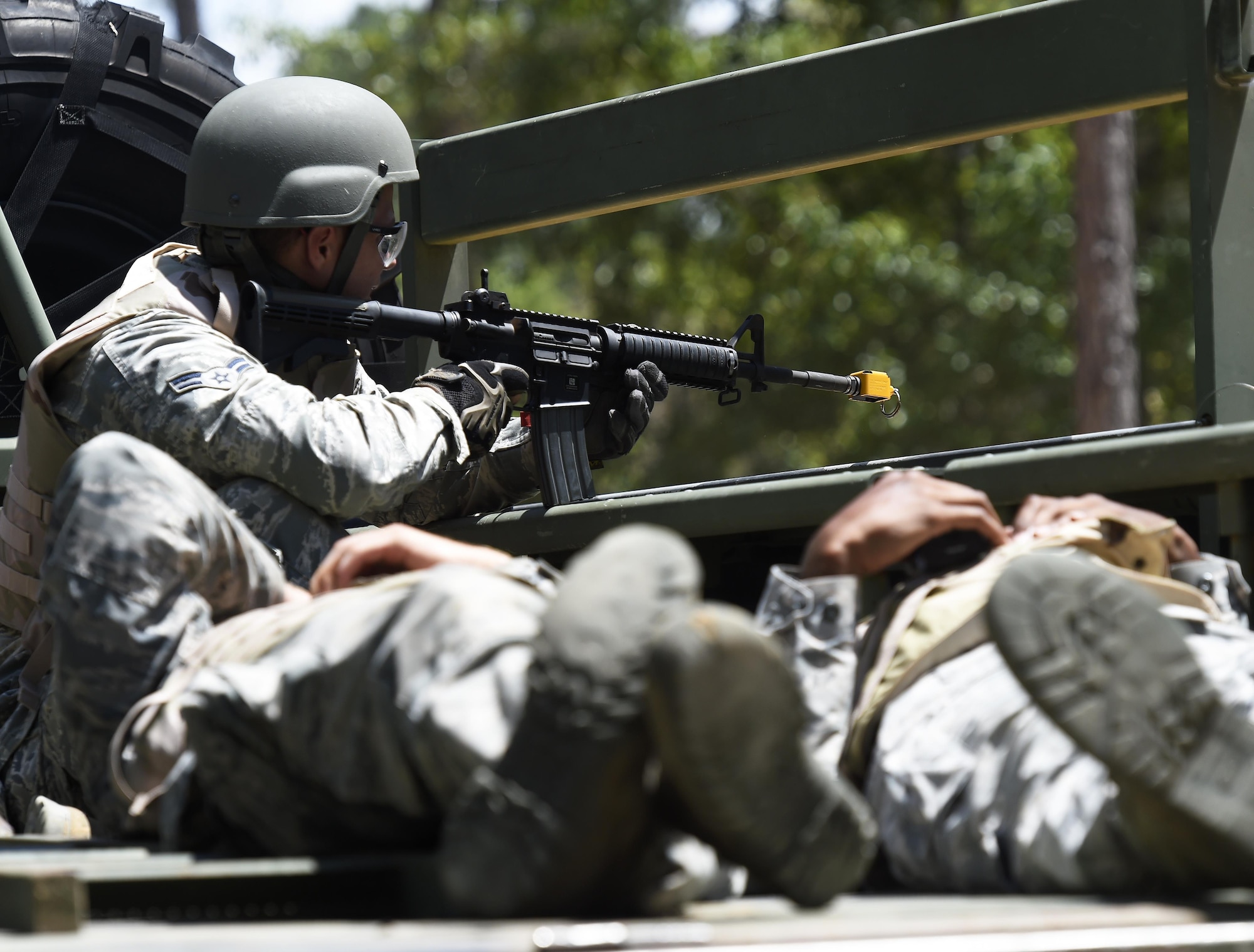 Airmen from the 1st Special Operations Civil Engineer Squadron evacuate simulated casualties during tactical convoy operations training at Eglin Range, Fla., July 1, 2015. The 1st SOCES conducted convoy training as preparation to repair or construct equipment and facilities outside the wire during deployments.  (U.S. Air Force photo by Airman Kai White/Released)