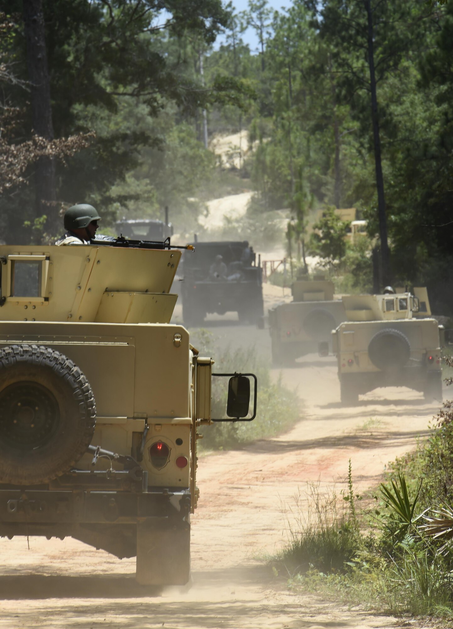 Airmen from the 1st Special Operations Civil Engineer Squadron return to Hurlburt Field after tactical convoy operations training at Eglin Range, Fla., July 1, 2015. The 1st SOCES conducted convoy training as preparation to repair or construct equipment and facilities outside the wire during deployments.  (U.S. Air Force photo by Airman Kai White/Released)