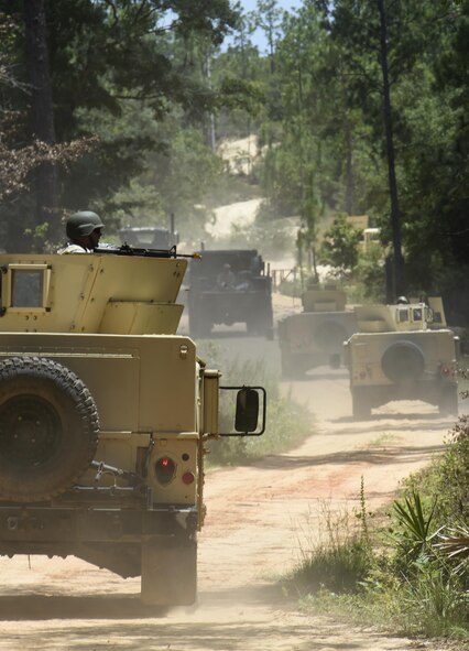 Airmen from the 1st Special Operations Civil Engineer Squadron return to Hurlburt Field after tactical convoy operations training at Eglin Range, Fla., July 1, 2015. The 1st SOCES conducted convoy training as preparation to repair or construct equipment and facilities outside the wire during deployments.  (U.S. Air Force photo by Airman Kai White/Released)