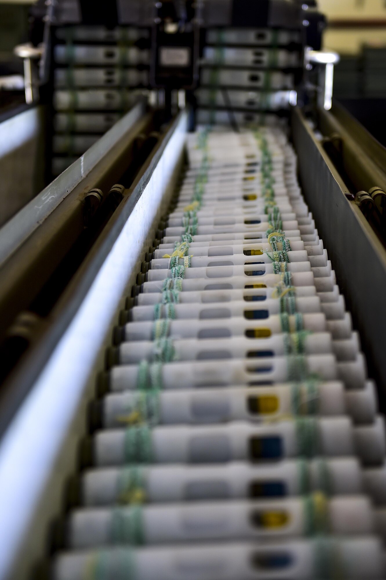 Linked Tube Carriers used to transport 25mm rounds are ready for transportation to the flightline at Hurlburt Field, Fla., June 23, 2015. The LTCs move through the 25mm processor to automate the loading and unloading of ammunition on the AC-130U Spooky gunship. (U.S. Air Force photo/Senior Airman Jeff Parkinson)