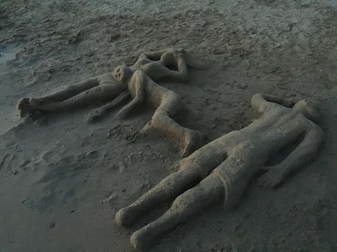 This sand family was discovered during a beach patrol by summer ranger, Ethan Speicher, at Big Hill Lake in Cherryvale, Kansas, July 11. The works were created by Jereme Glenn, with the help of his family earlier that day.